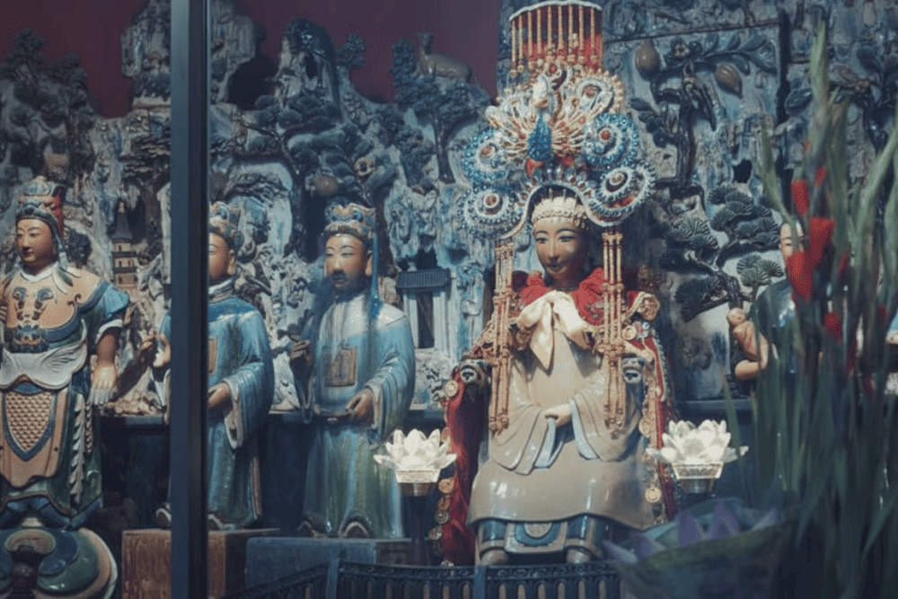 Devotees typically bring offerings such as fresh flowers, tropical fruits, and symbolic paper money to express their wishes